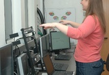 Louise signals Xochitl to deliver nicotine vapor to the participant in the scanner.